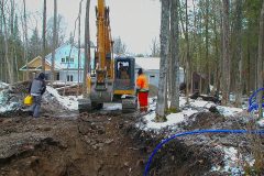 CARAPACE installed into Excavator dug hole at job site outdoors