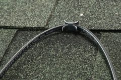 Paladin for Roof heating cable clipped onto green shingled roof