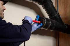Contractor Installing Retro-DWS Internal Self-Regulating Tubular Heat Trace Cable System into Pipe