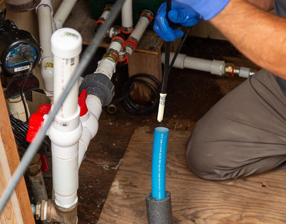 Retro-Line heating cable feeding into water supply pipe
